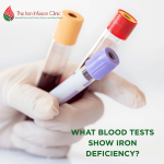 Lab assistant/pathologist holding tubes of collected blood
